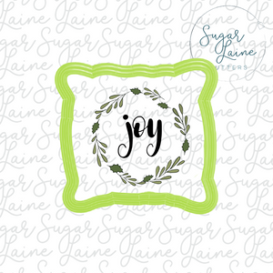 Slouchy pillow cutter with Joy wreath silk stencil